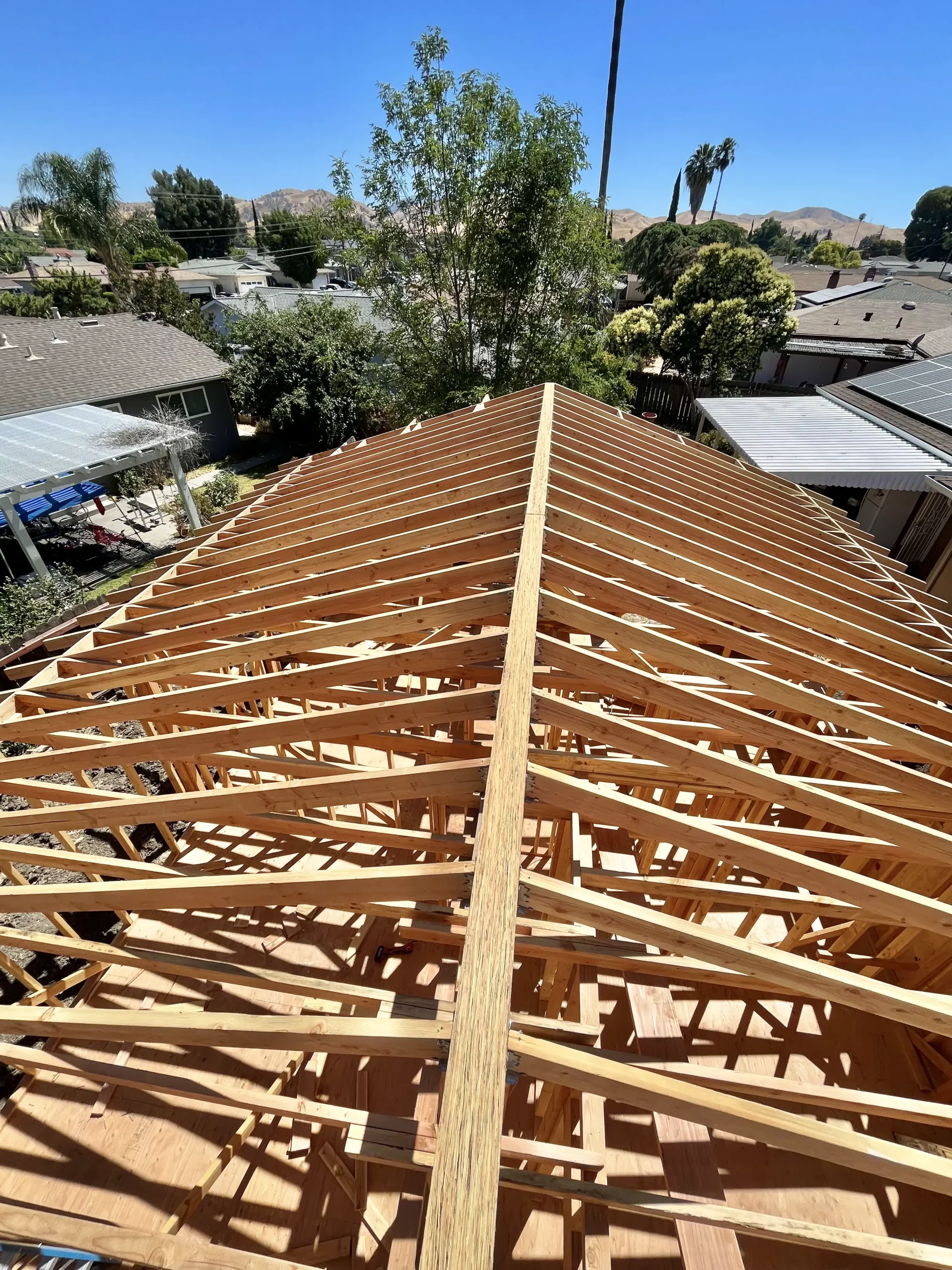The roof of a house with wood framing.