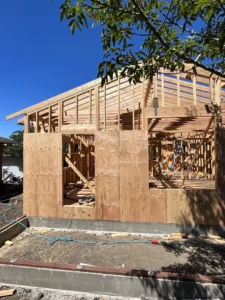 A house under construction with wood framing.